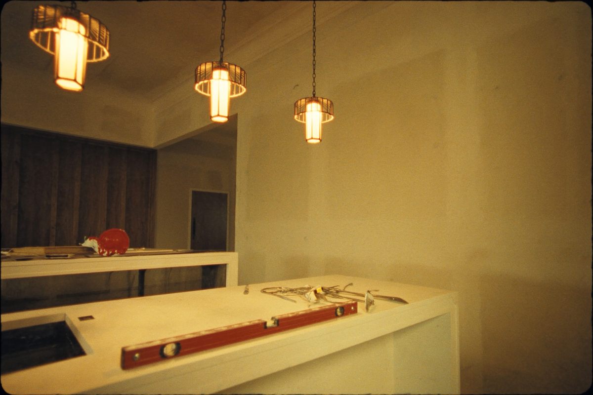 A finished high-end kitchen remodel with tools resting on the counter